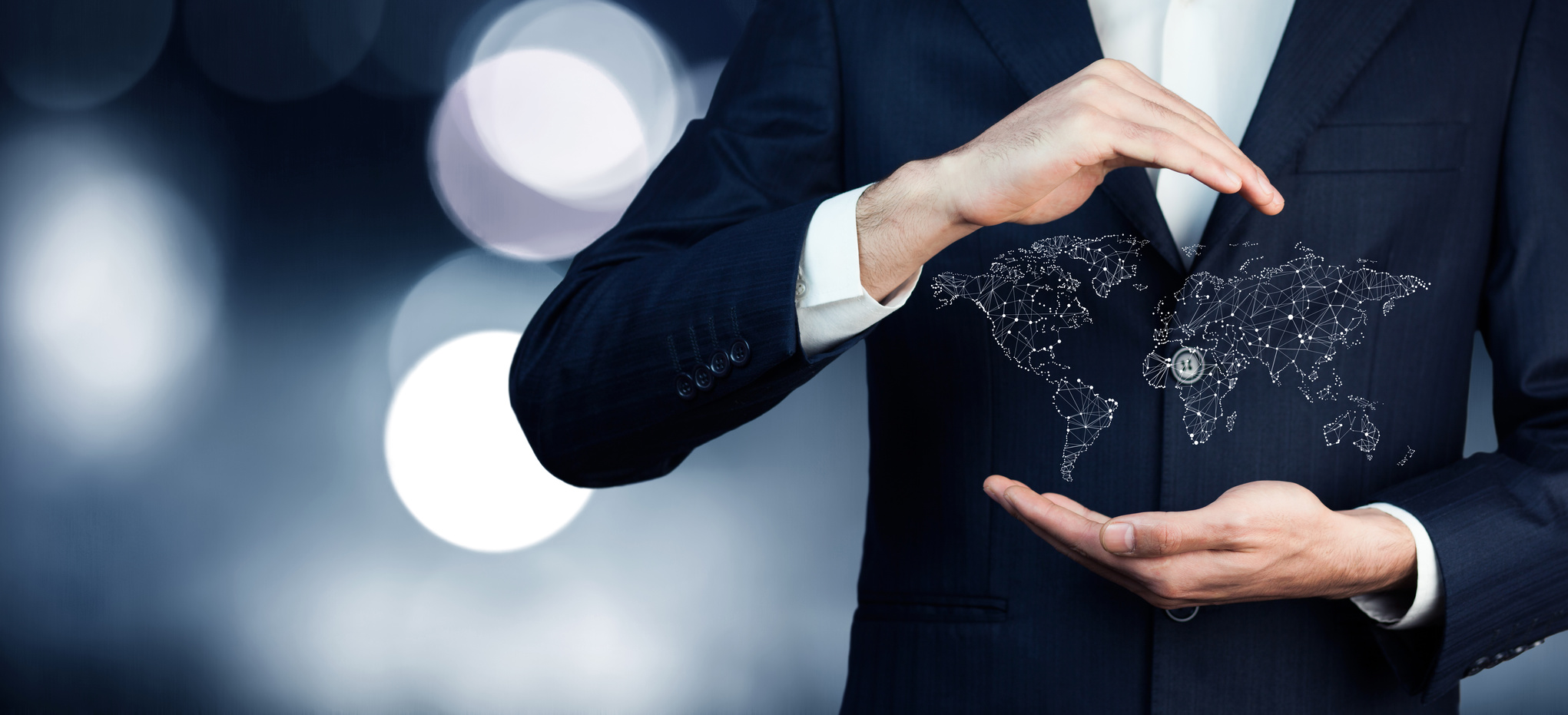 businessman holding world map in hands